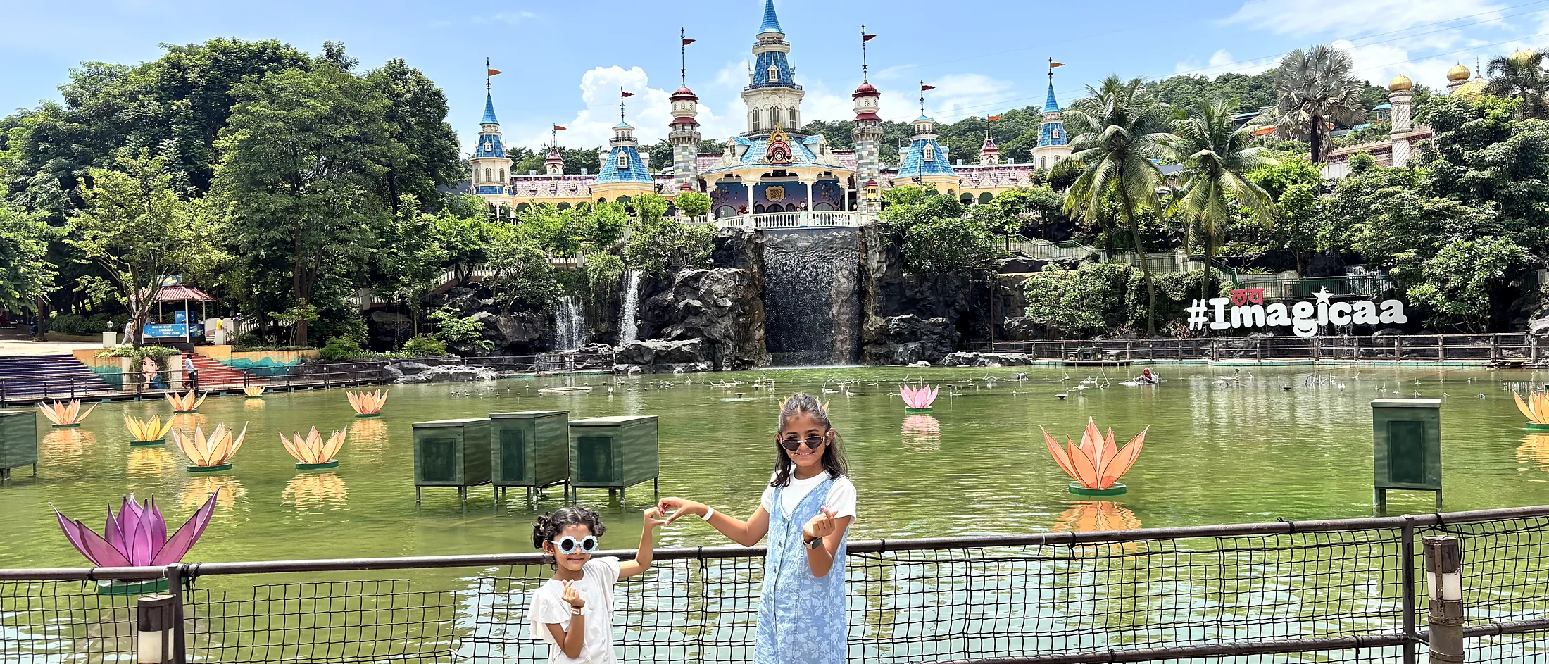 Nishtha and Nityaah at a theme park lake