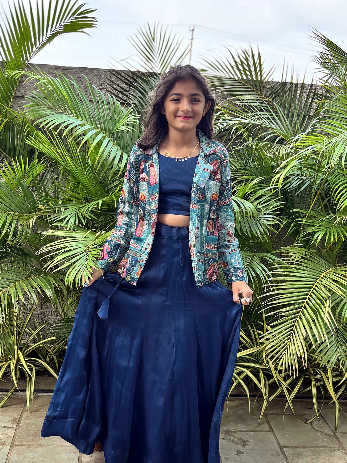 Nishtha in a navy lehenga and printed jacket