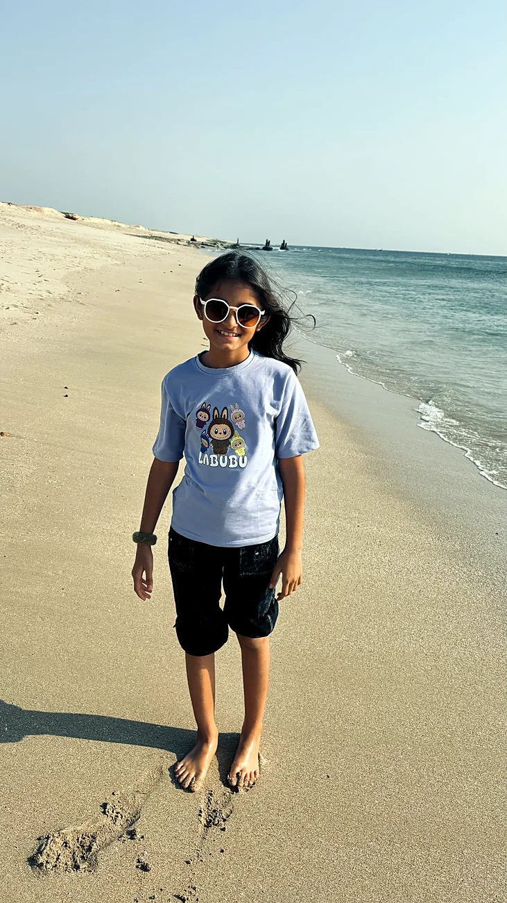 Nishtha walking along the shoreline