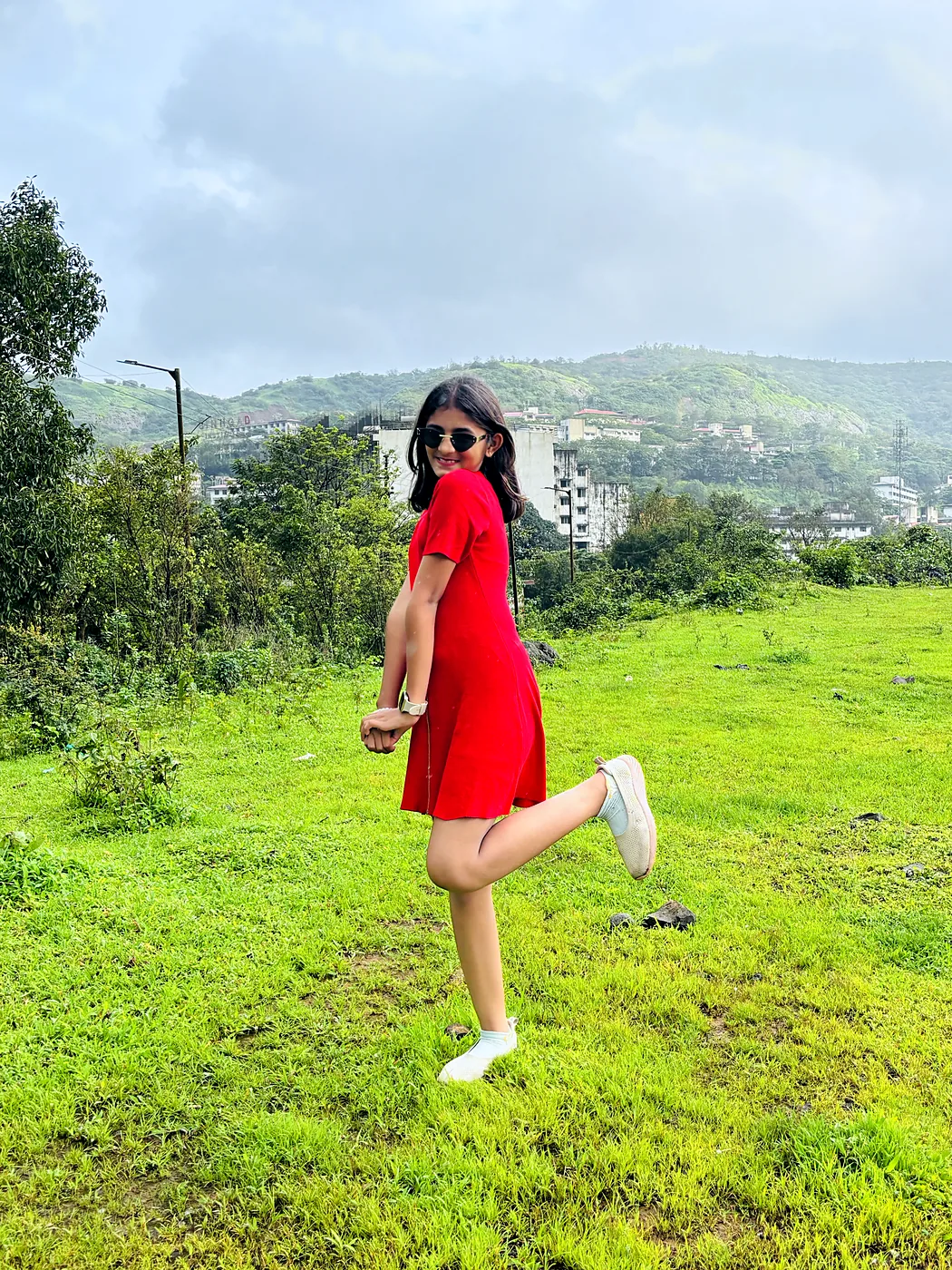 Nishtha mid-step in a green field