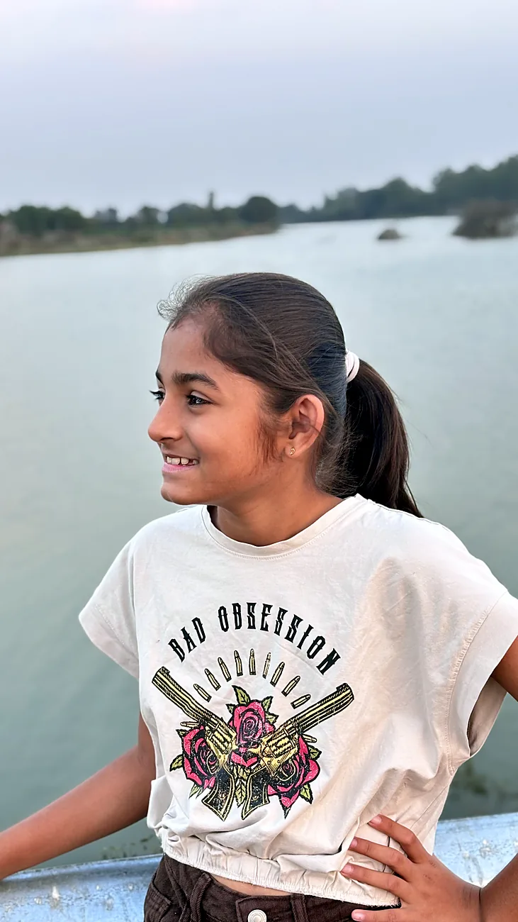 Nishtha standing by a lake