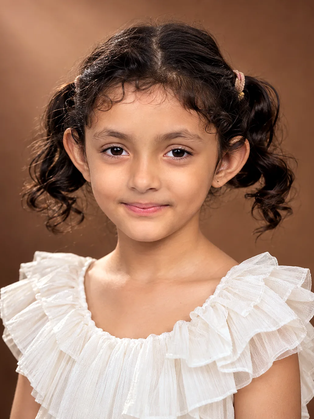Studio portrait of Nityaah smiling